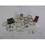 A quantity of silver and costume jewellery to include necklaces, pendants, bracelets and charms