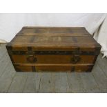 An early 20th century rectangular leather and wood bound steamer trunk with brass fittings, locks