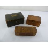 Three rectangular stationery boxes to include a leather bound box with brass handle and two wooden