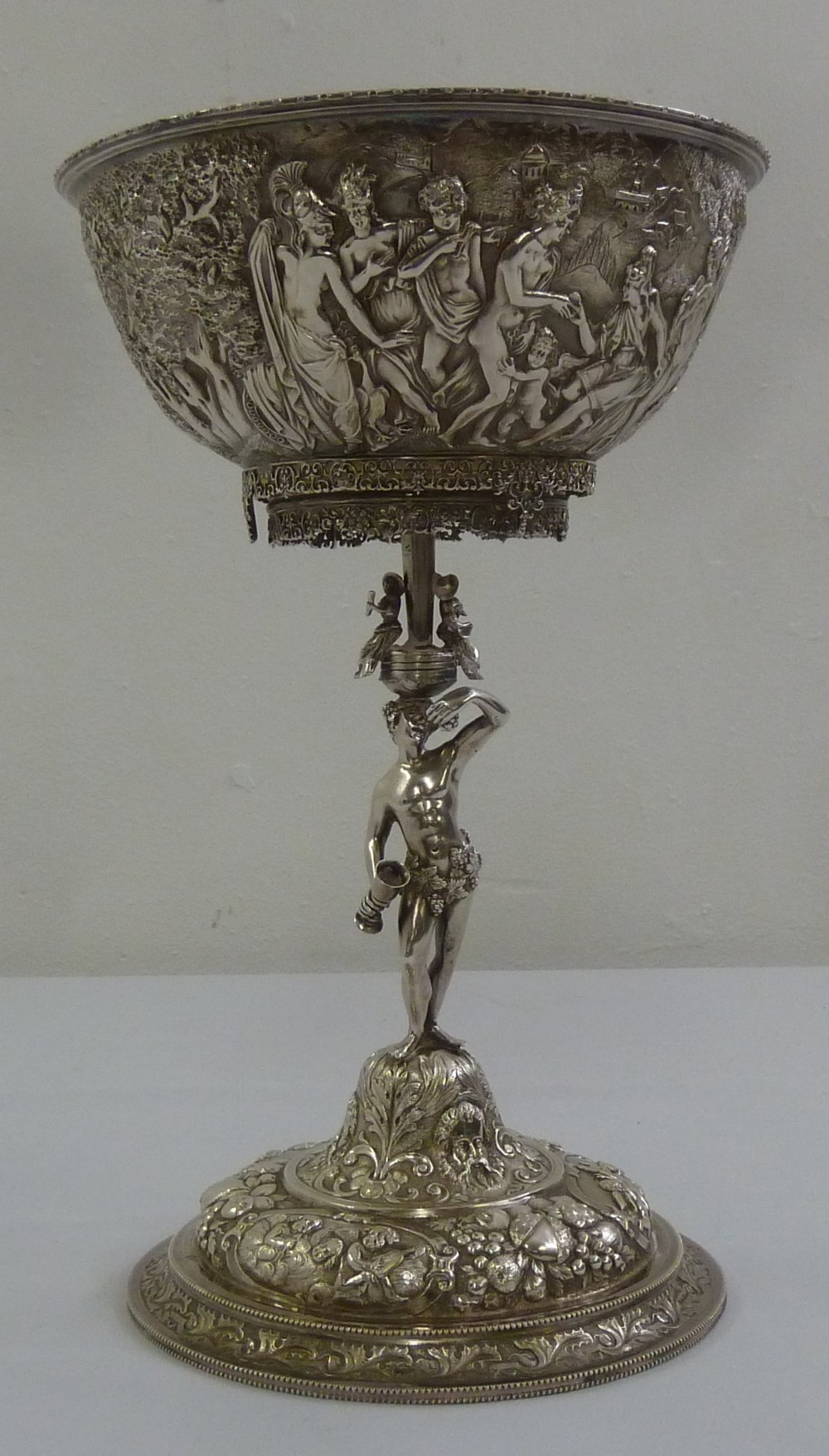 A 19th century Continental white metal centrepiece the bowl heavily chased with classical figures