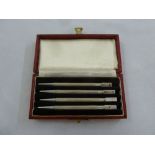 A cased set of silver engine turned bridge pencils