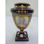 A Sevres blue ground baluster vase decorated with hand painted portrait of a lady and gilded