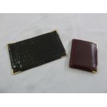 Asprey black crocodile skin leather bill fold with 9ct gold mounts and an Aspreys red leather wallet