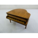 A Swiss miniature satinwood music box in the form of a baby grand piano