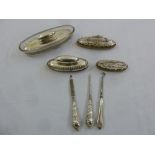 Four silver mounted nail buffs, a button hook and two manicure pieces (7)