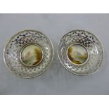 A pair of silver dishes with Royal Worcester hand painted plaques signed Rushton, hallmarked