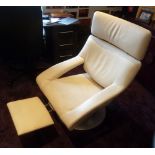 A white leather armchair with retractable foot stool on circular metal base