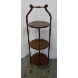 Mahogany three tier plate stand of customary form