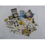 A quantity of costume jewellery to include necklaces, brooches and bracelets