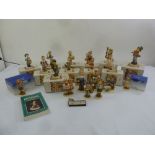 A quantity of Hummel and Goebel figurines of children, most in original packaging (20)