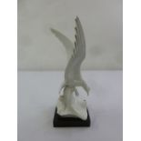 Meissen blanc de chine figurine of a bird on square raised plinth, marks to the base, A/F