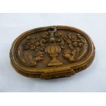 An early 19th century wood spectacle case profusely carved to both hinged sides