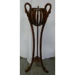 Mahogany plant stand with swan handles and three curved supports