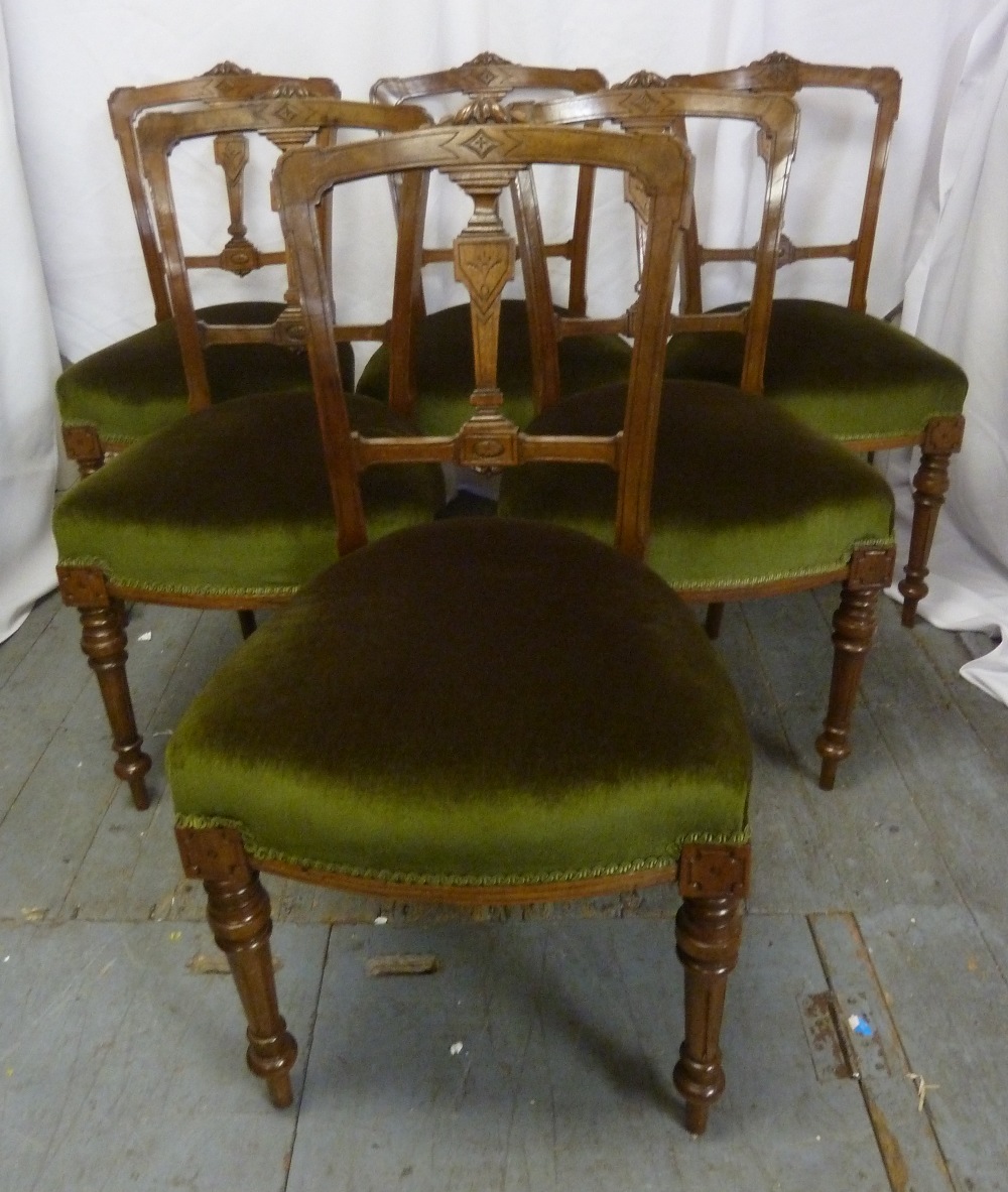 A set of six Victorian mahogany dining chairs carved backs and upholstered seats