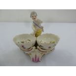 KPM salt with putti figurine the bowls decorated with Watteau style images of courting couples