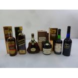A quantity of whisky, cognac and sherry to include Johnnie Walker Black Label, Hennessey XO
