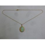 15ct rose gold pendant set with an opal on an integrated chain