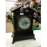 A large ebonised Aesthetic Movement mantel clock, with ornate brass side panels & mounts,