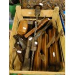 A box of woodworking tools including planes,