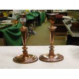 Pair of antique copper candlesticks on oval plinth bases