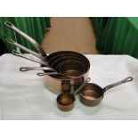 Graduated set of 7 copper pans with steel handles