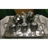 A 5 piece 1930s Heatsaver tea set with metal covers,