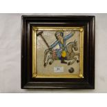 A Persian Islamic ceramic tile with moulded & painted design depicting a polo player,