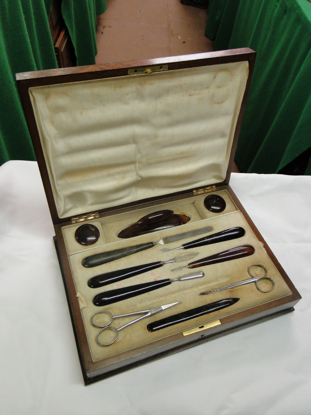 An Inlaid burr wood vanity box with fitted interior & manicure set