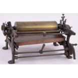 An Antique cast-iron framed printing press with brass drum, drum length 10".