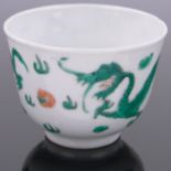 A Chinese porcelain tea bowl, with painted enamelled dragon design, diameter 3.25".