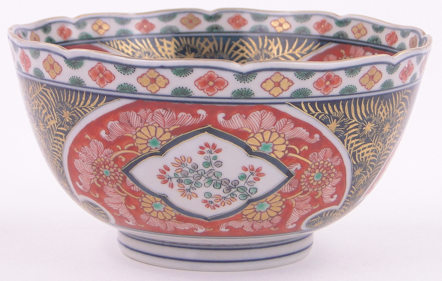 A Chinese Imari porcelain bowl, with painted and gilded panels, 6 character mark under, diameter 7",