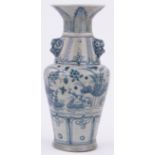 An Oriental blue and white ceramic vase, with dragon handles and painted designs, height 10".
