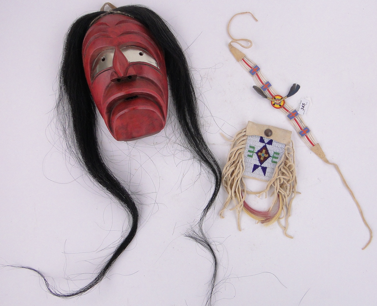 A Native American Iroquois drooping mouth mask, made by Hoda Nyehen (Stick on the Shoulder),