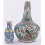 A Chinese Famille Vert porcelain baluster vase, with painted panels of exotic birds,