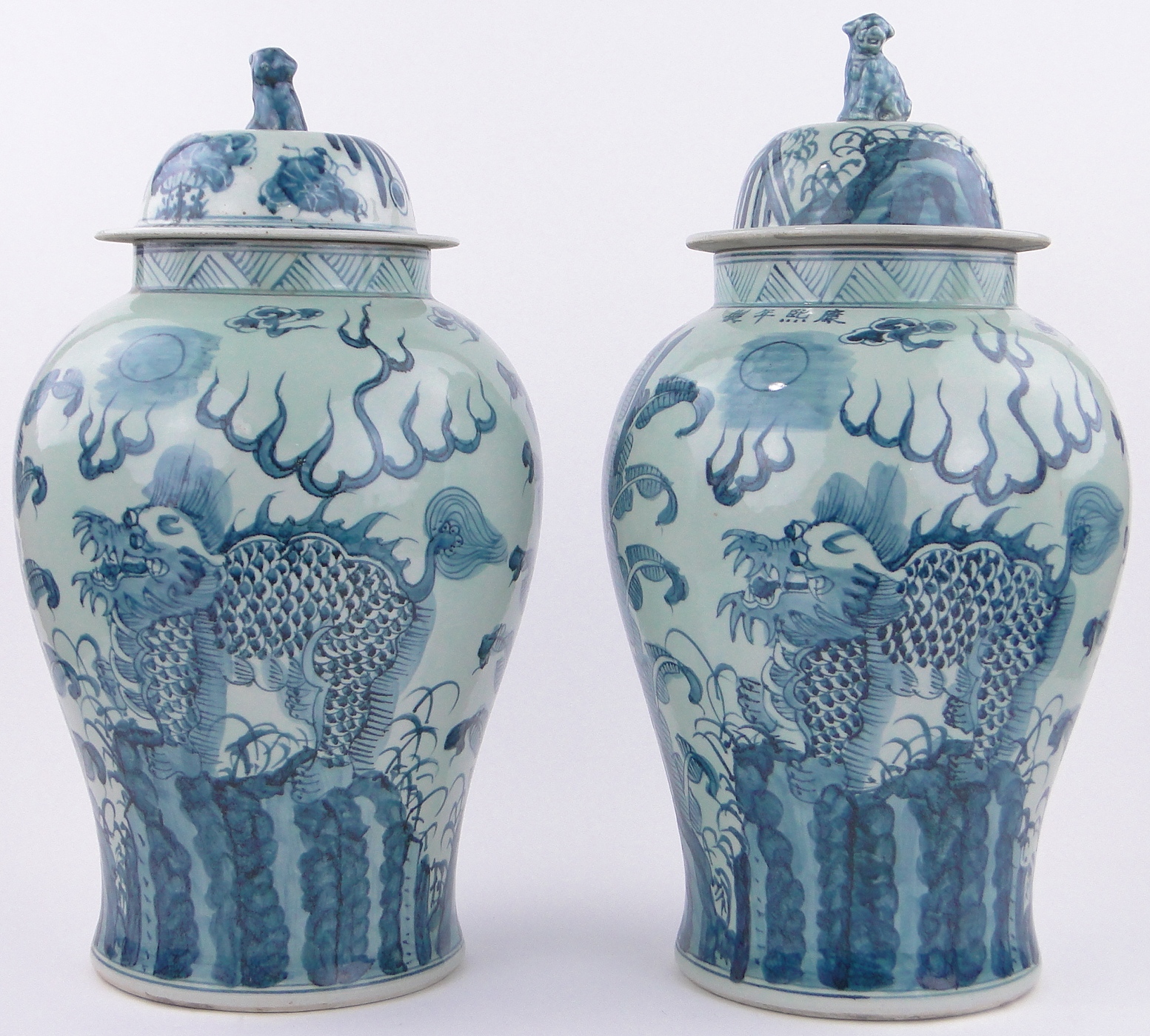 Pair of large Chinese blue and white porcelain vases, with painted dragons and text, height 22".