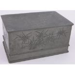 A Chinese rectangular pewter box, with engraved dragons and seal mark under, length 9".