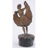 A 19th century Vienna cold painted and gilded bronze erotic dancing girl with lift-up skirt,