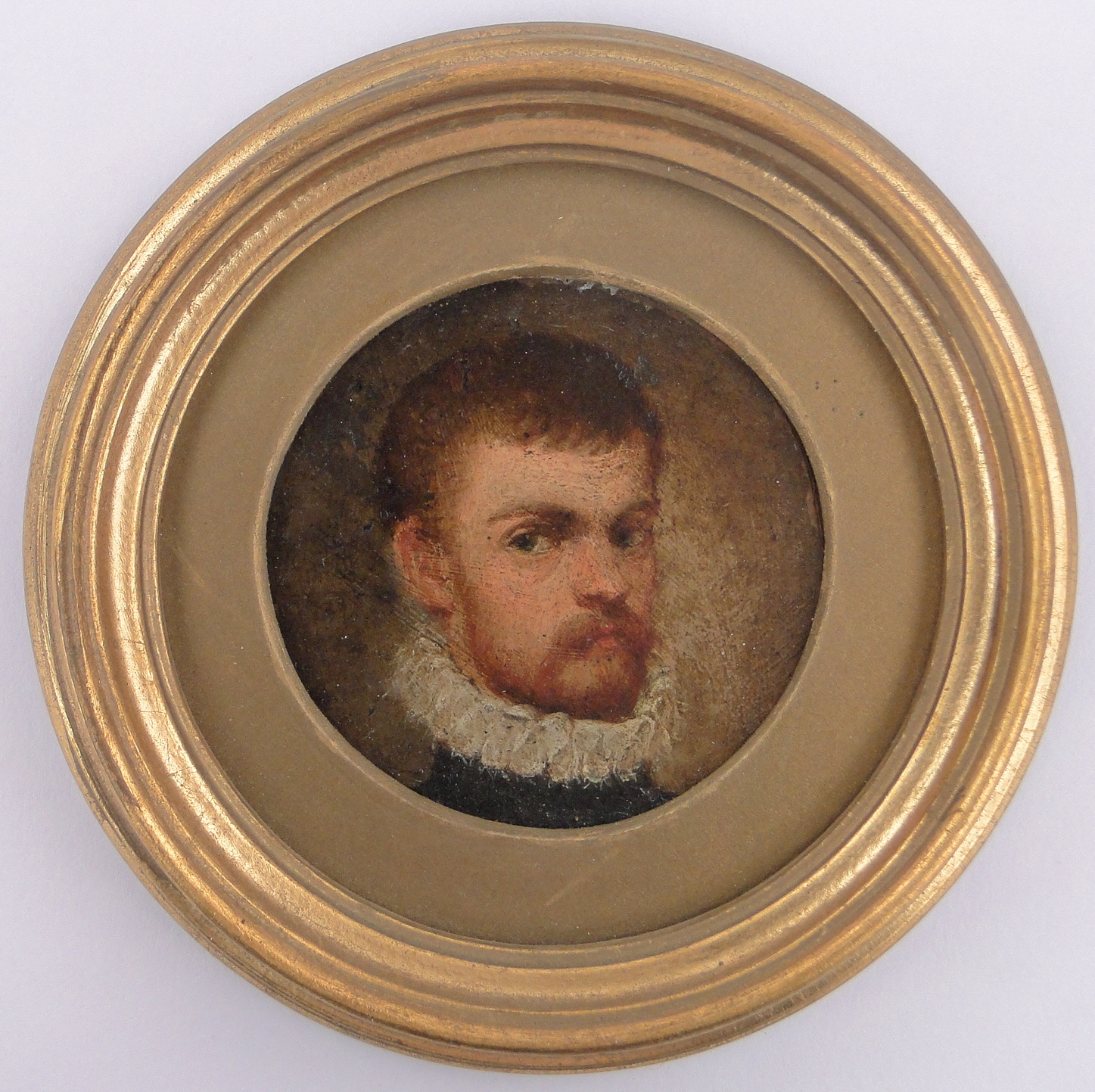 A 19th century miniature oil painting on metal, portrait of a man wearing a ruff, unsigned,