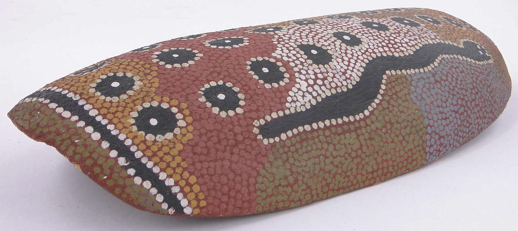 An Australian Aboriginal wood wall hanging, with painted snake designs, length 15.5". - Image 2 of 3