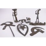 A group of African bronze figures, Russian brass hammer and sickle mounts, etc.