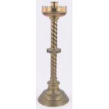 A large 19th century brass Gothic style church candlestick,