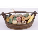 A large Collection of carved coloured stone ornamental fruit in wooden bound Scandinavian style