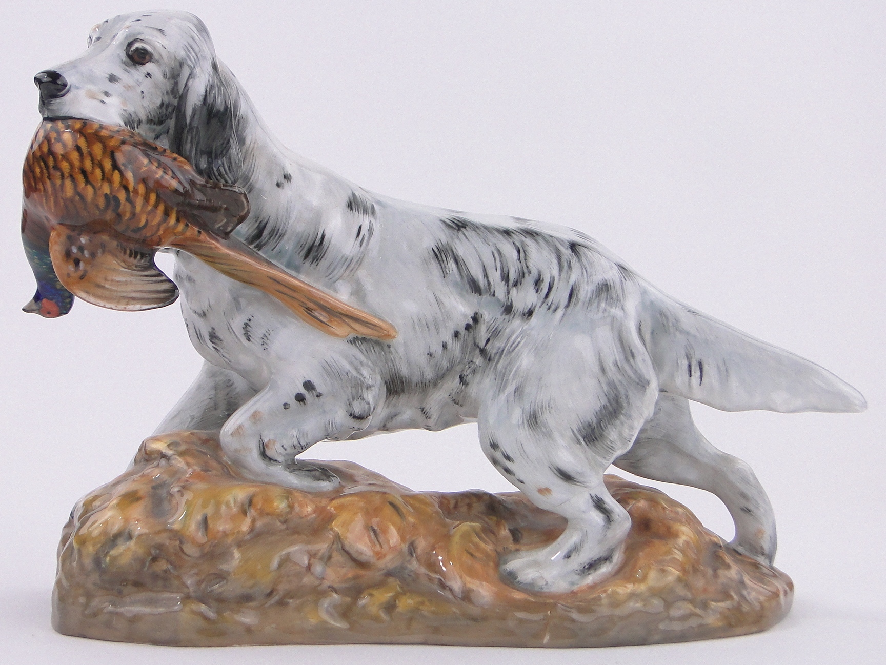 A Royal Doulton Gundog with pheasant, HN 2529, length 11" base a/f.