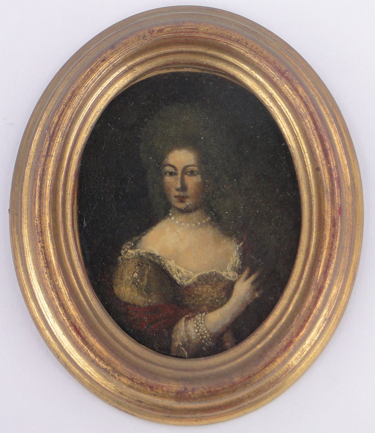 An 18th century miniature oil on metal, portrait of a woman, unsigned, moulded giltwood frame,
