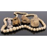 A Collection of Antique ivory, including a miniature skull on pedestal, height 1.