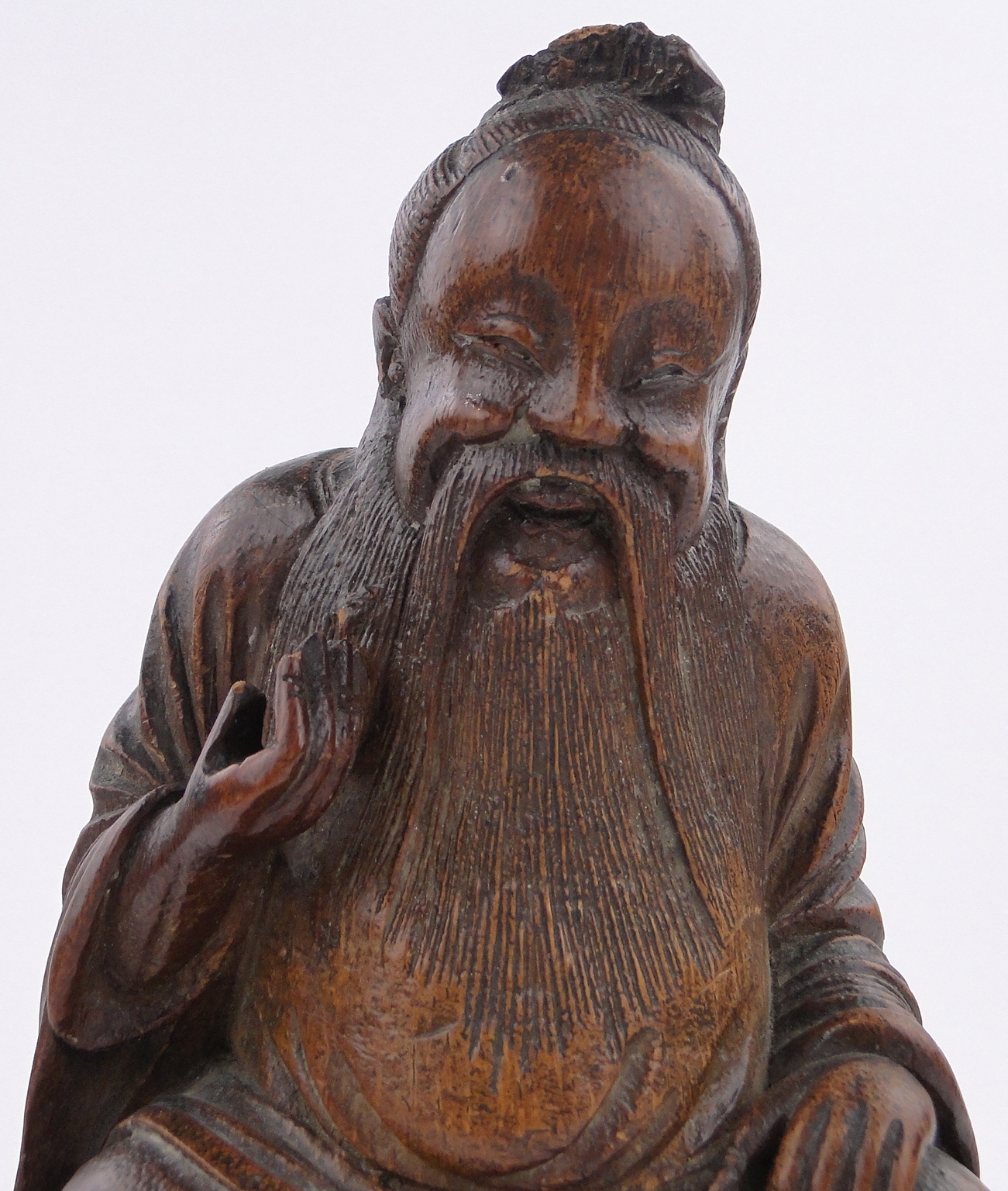 A Chinese carved stained wood figure of a sage, height 9.5". - Image 3 of 3