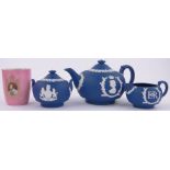 A Wedgwood Jasperware 3-piece Commemorative teaset and a Doulton 1937 Coronation Ware cup, (4).