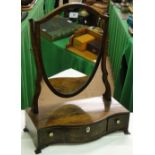 A mahogany swing toilet mirror with serpentine front and drawers under.