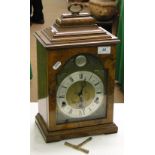 A burr walnut cased mantel clock with 3-train movement.