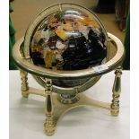 A terrestrial globe on stand with inlaid hardstone decoration.